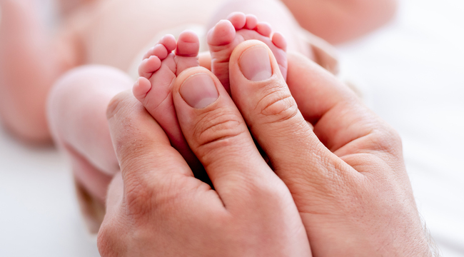 Carousel_mother-holding-newborn-baby-feet-2023-11-27-05-33-42-utc
